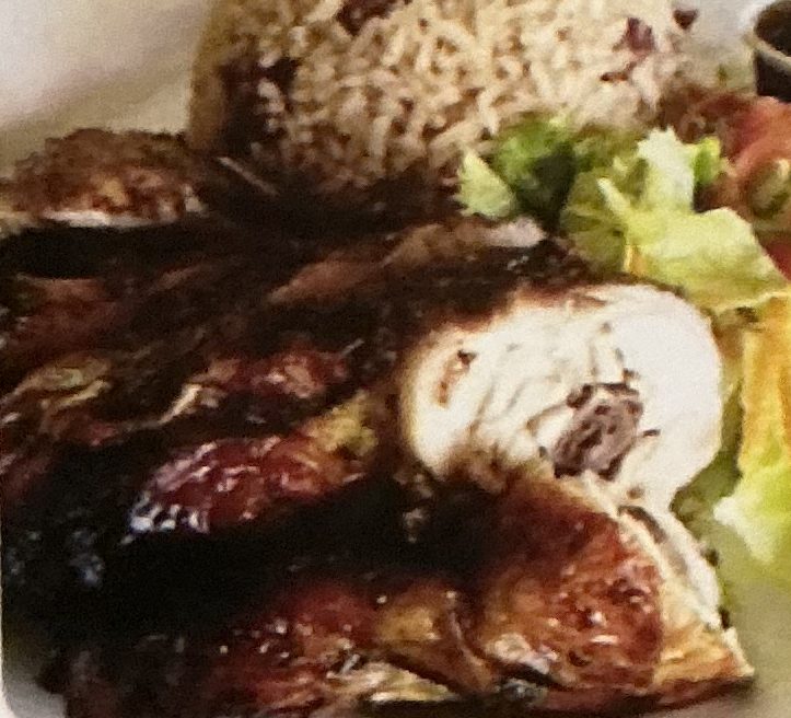 Jerk chicken with rice and beans and salad