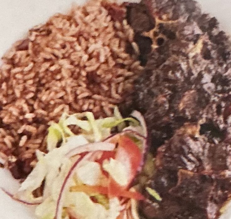 Oxtail with rice and beans and cabbage
